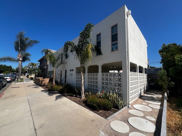 245 Church Ave on its walkable Chula Vista street, with mature palms and stepping-stone path